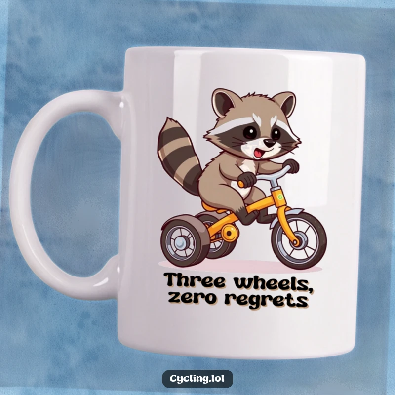 Funny Raccoon Mug: A mischievous raccoon expertly performs a wheelie on a tricycle, showcasing daring and humor for a great gift.